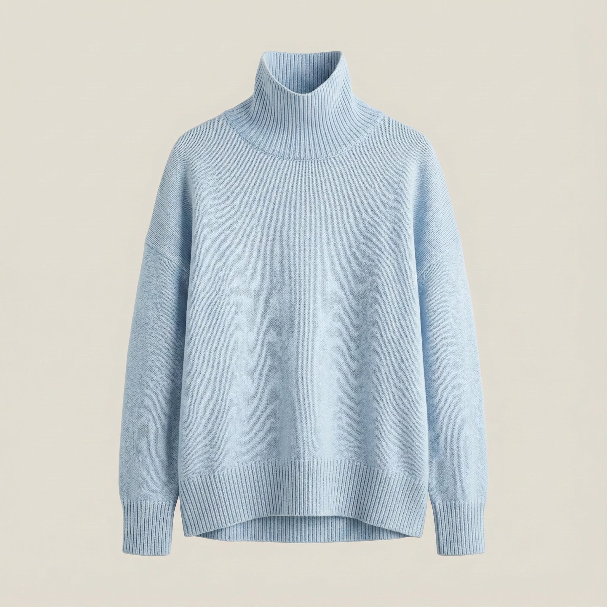 Light blue turtleneck sweater on a beige background
