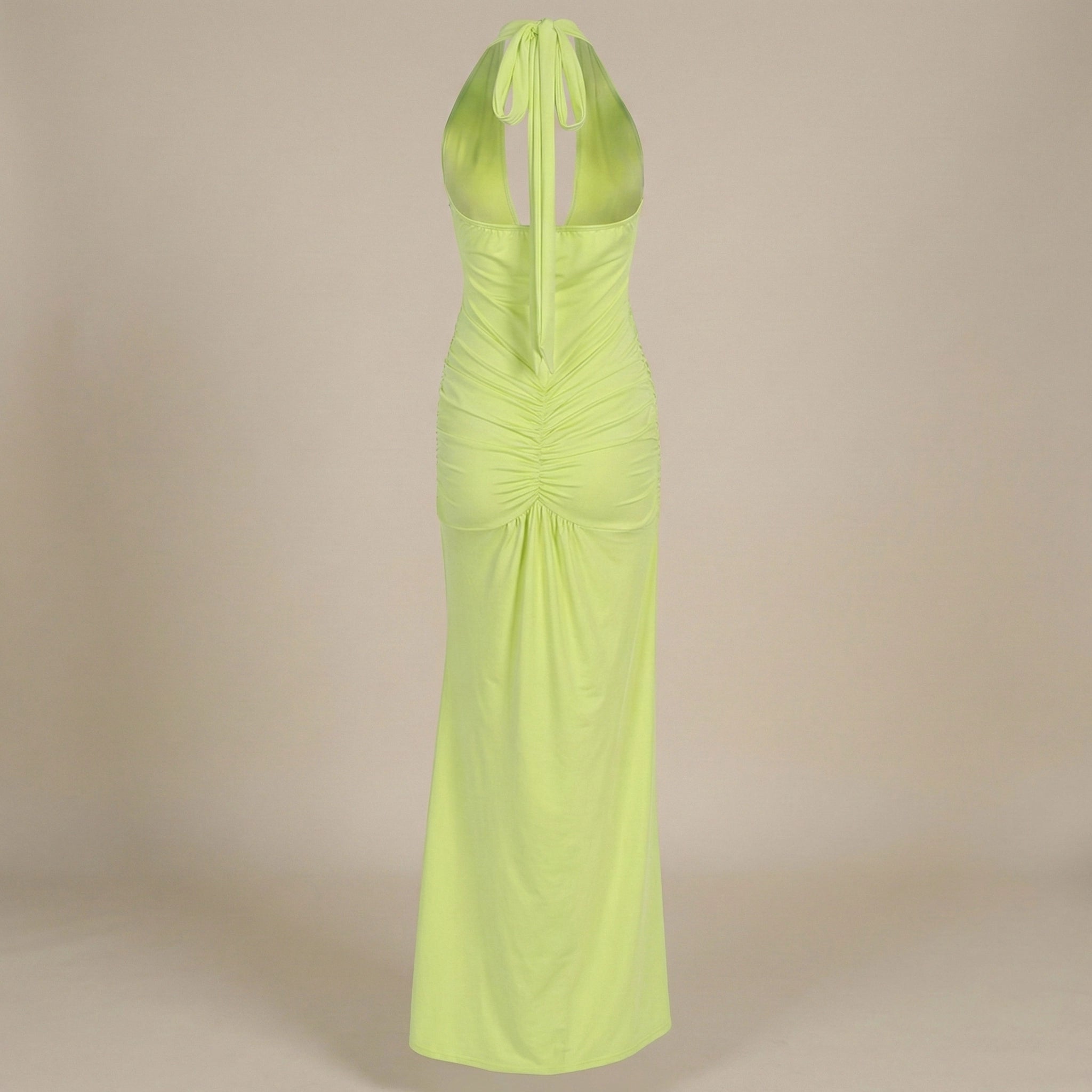 Lime green halter neck dress on a beige background