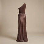 Brown one-shoulder evening gown on a beige background