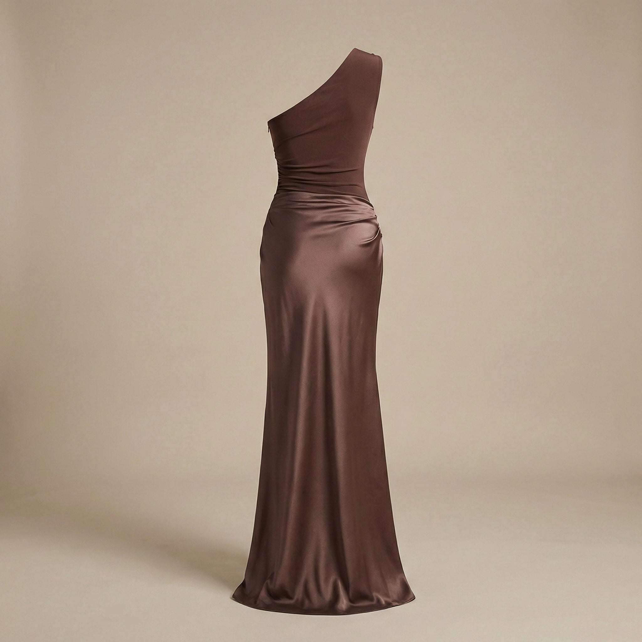 Brown one-shoulder evening gown on a beige background