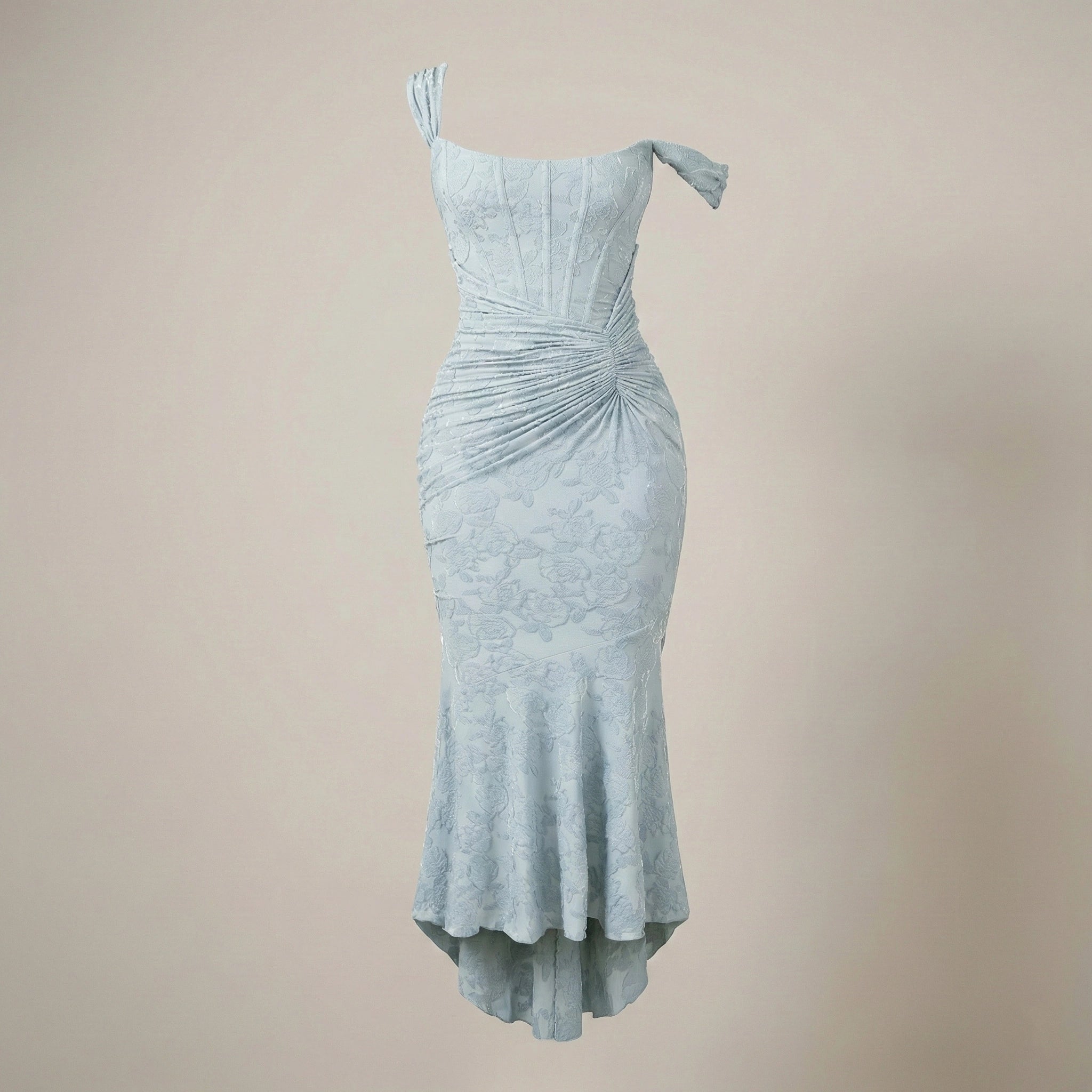 Light blue dress with ruched details on a beige background