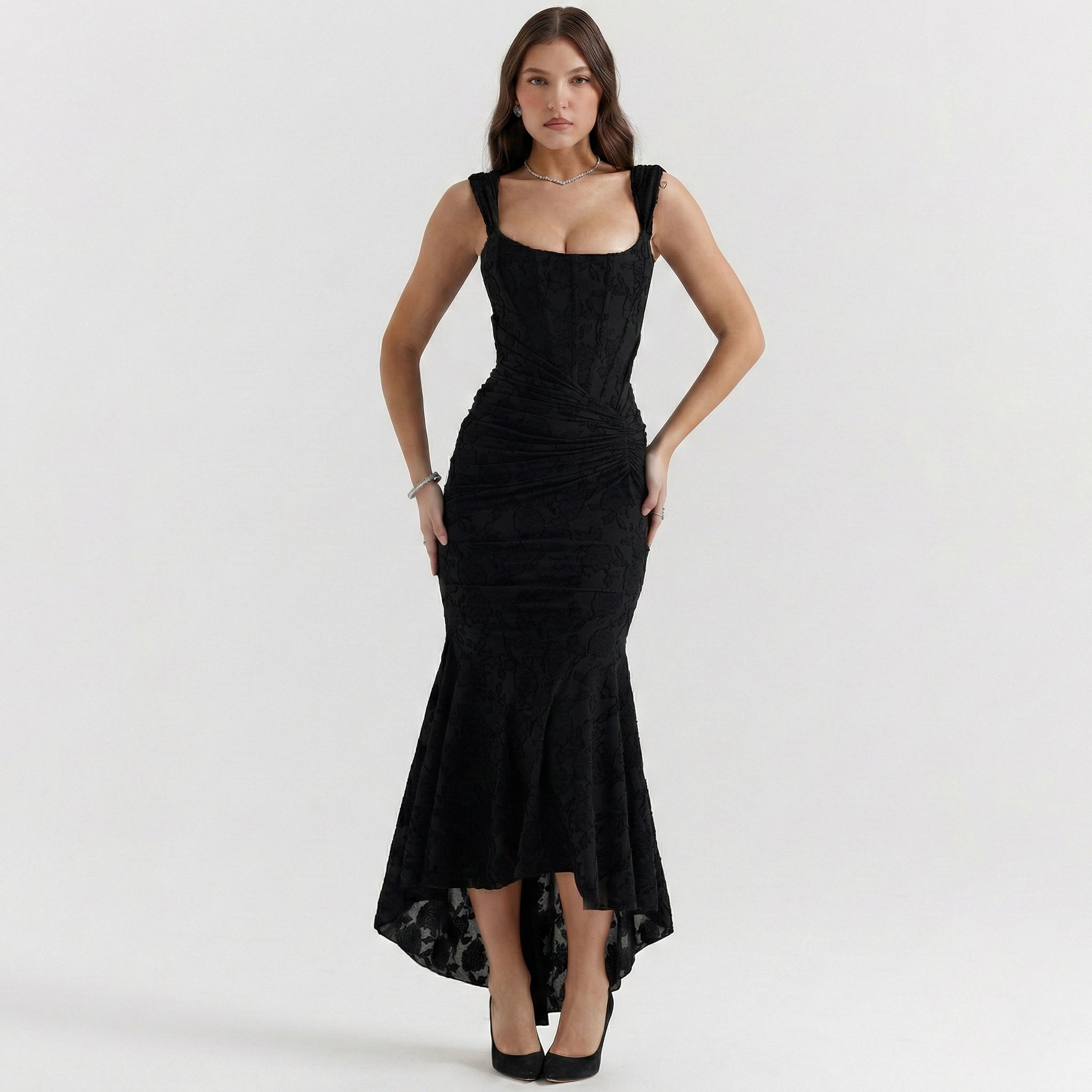 Woman wearing a black dress on a white background