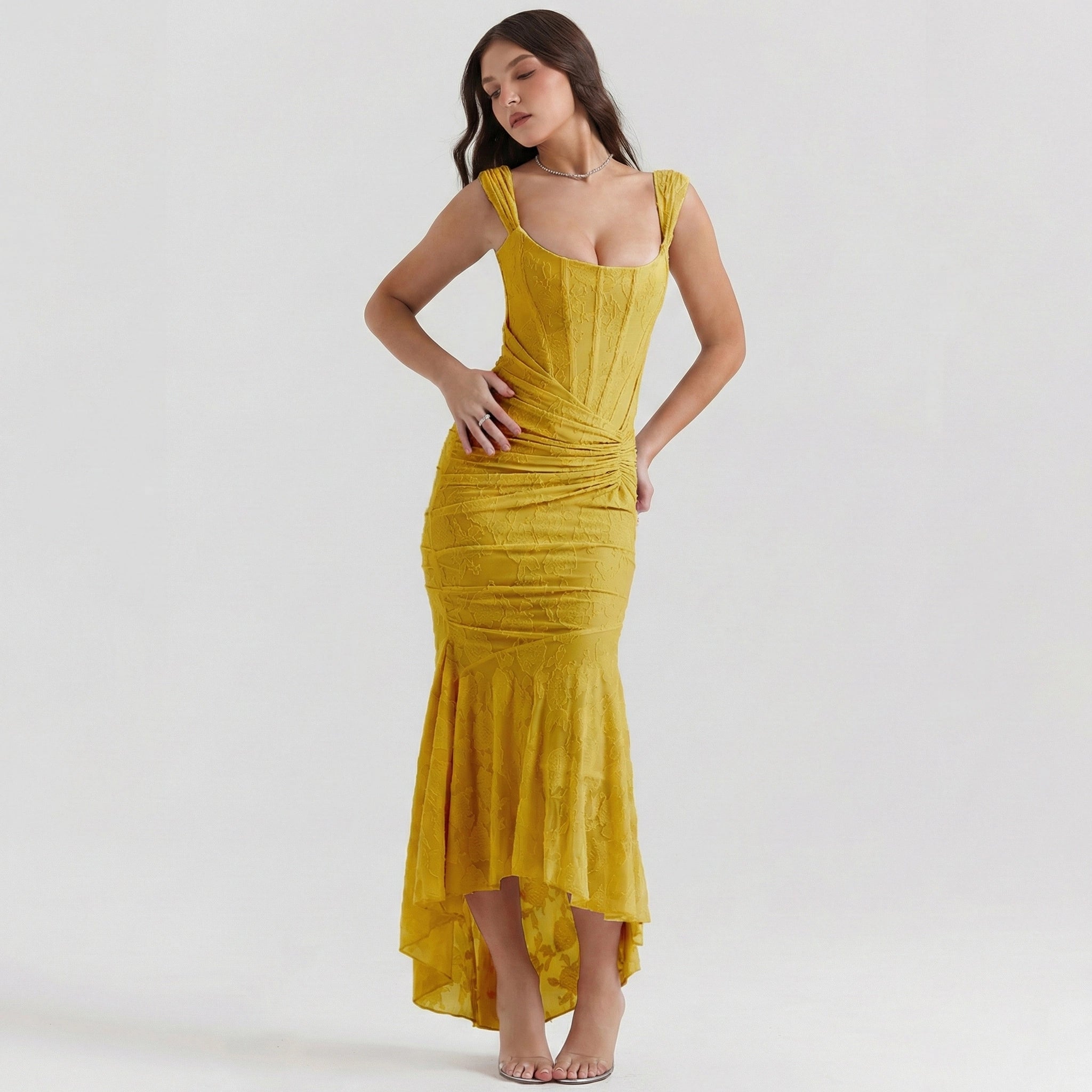 Woman wearing a yellow dress on a white background