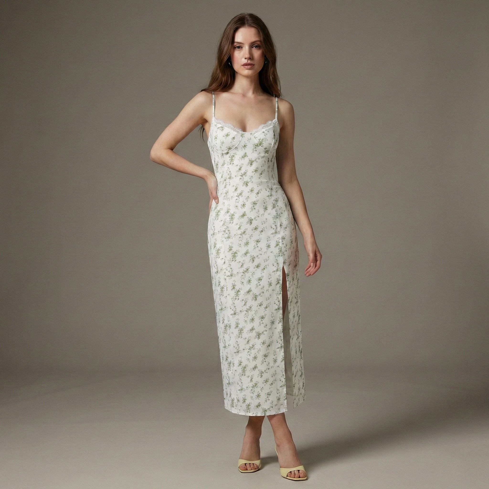 Woman wearing a floral slip dress against a neutral background
