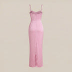 Pink evening gown with thin straps on a beige background