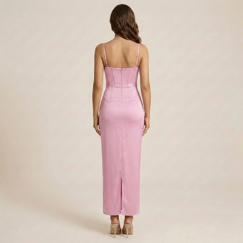 Pink dress with thin straps on a plain background