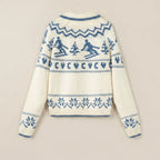 White sweater with blue pattern on a beige background