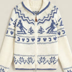 White zip-up sweater with blue pattern on a light gray background