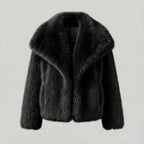 Black faux fur jacket on a light gray background