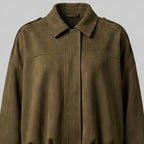 Brown leather jacket on a light gray background