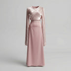 Pink dress with long sleeves on a light gray background