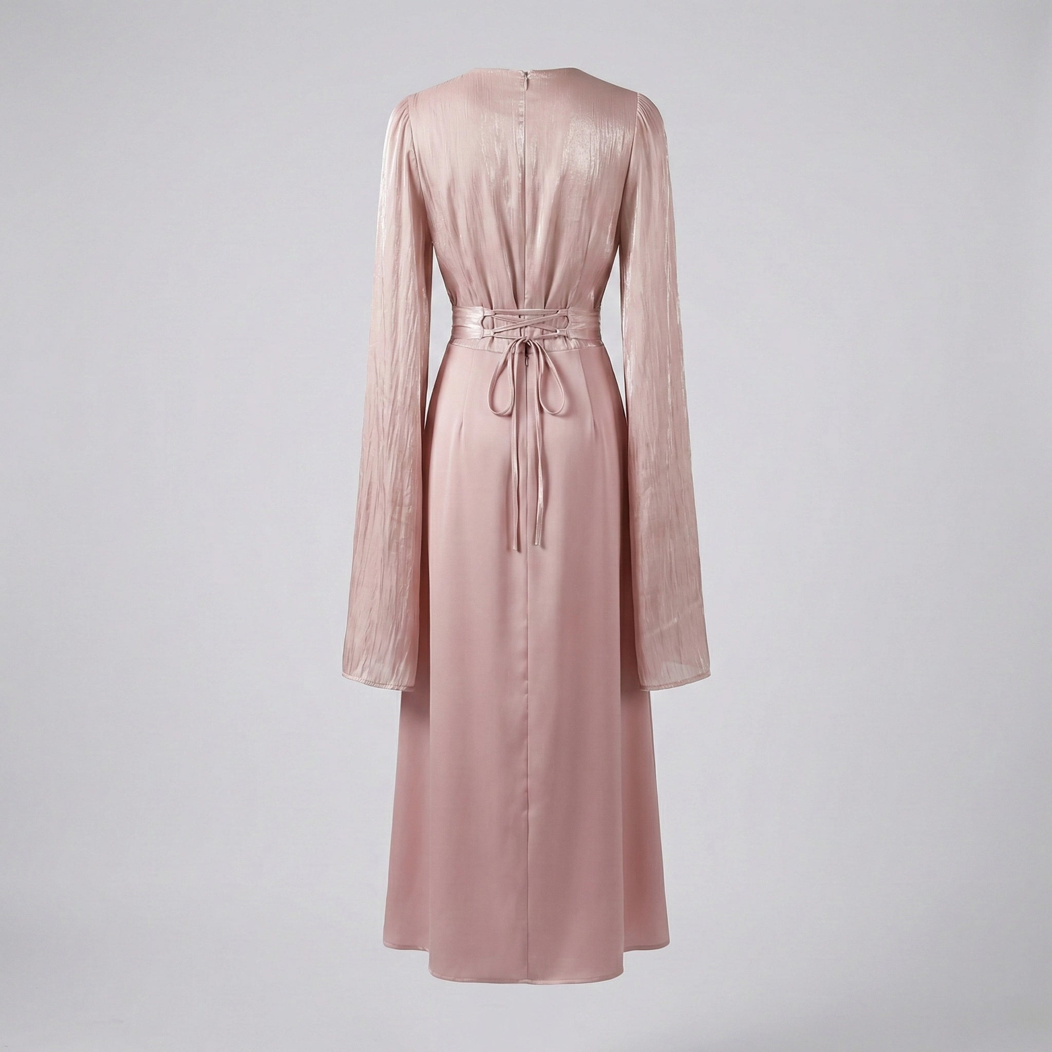 Pink dress with long sleeves on a light gray background