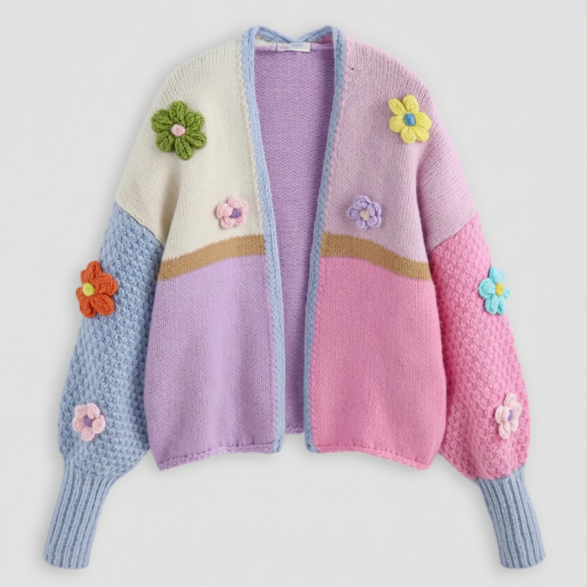 Colorful knitted cardigan with flower appliqués on a light gray background