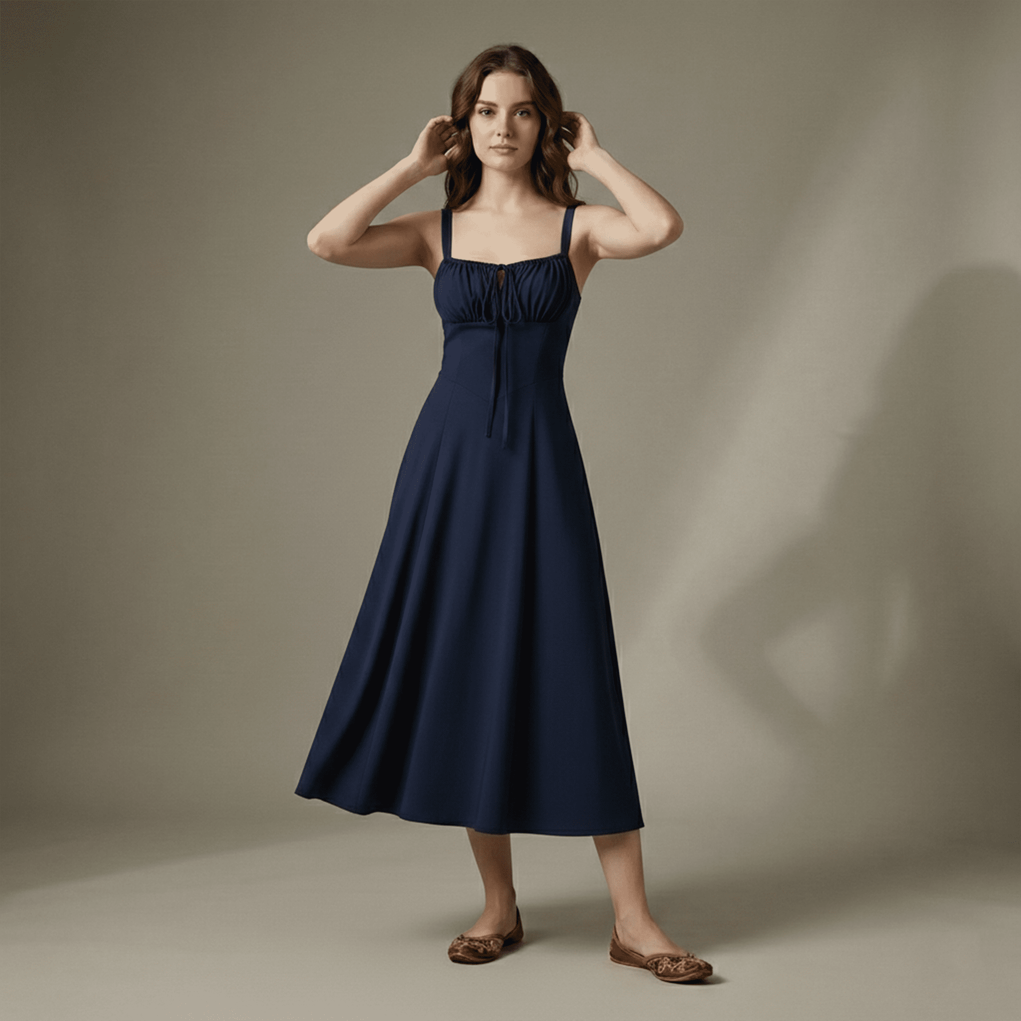 Woman wearing a navy blue dress against a plain background