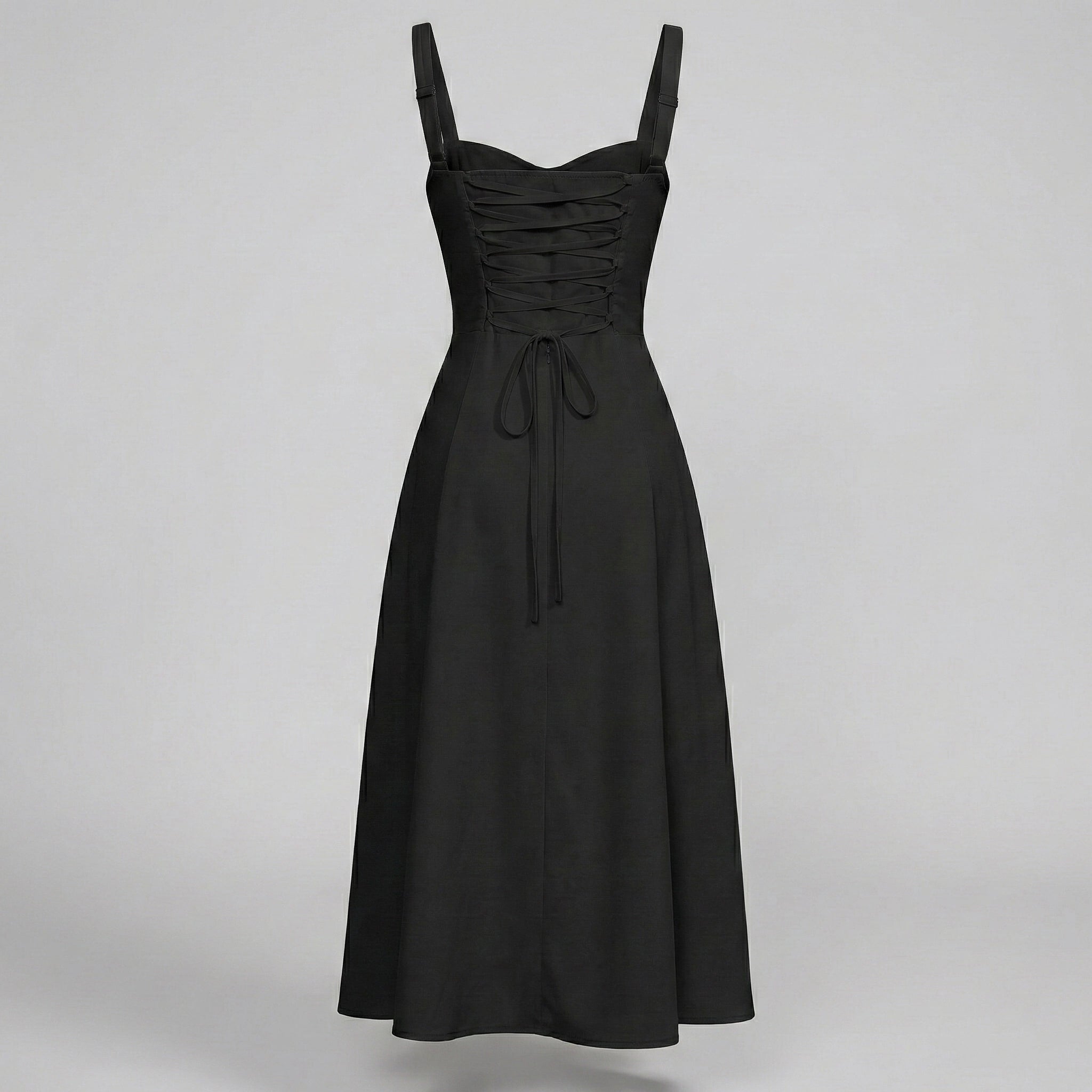 Black dress with thin straps on a gray background