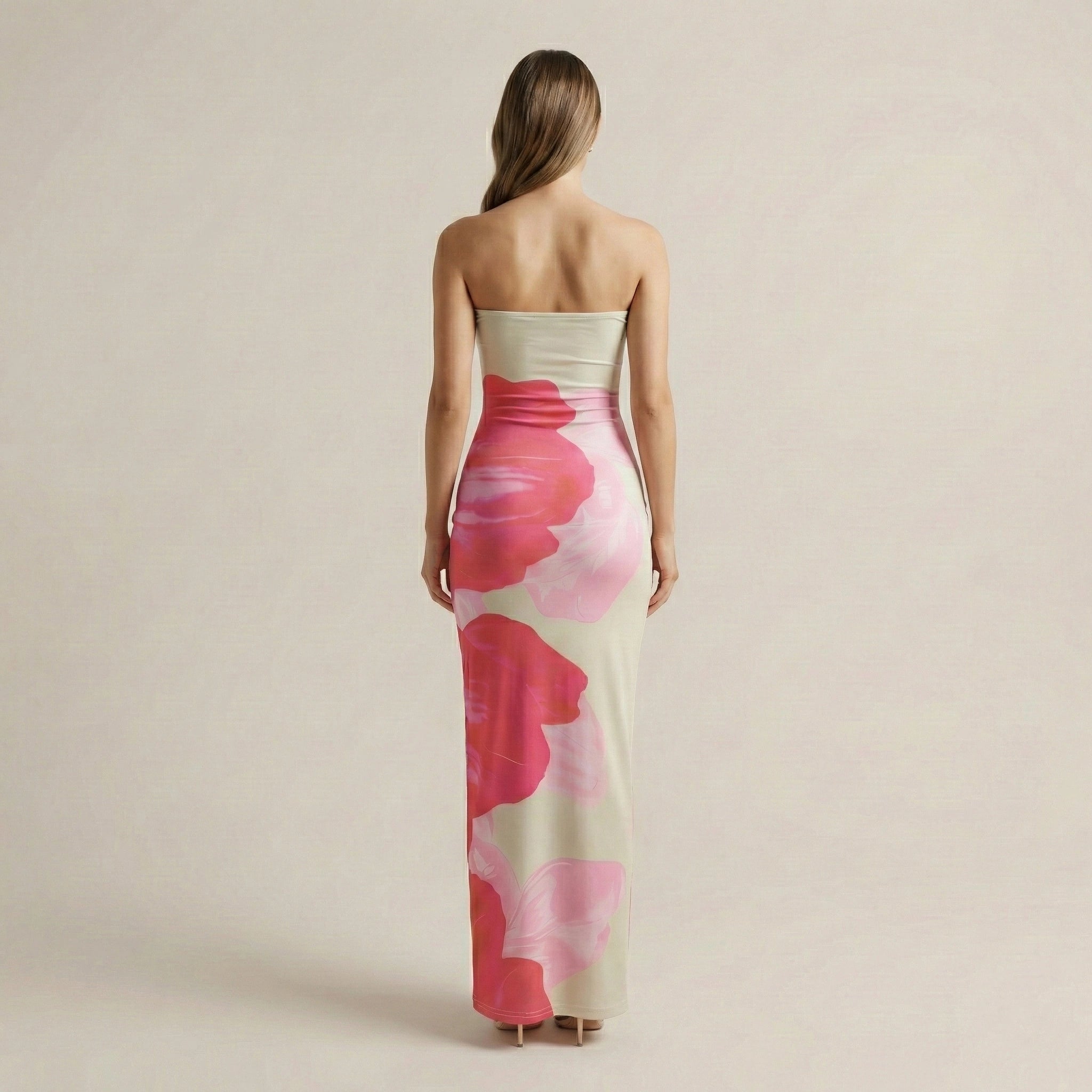 Woman wearing a strapless floral dress on a beige background