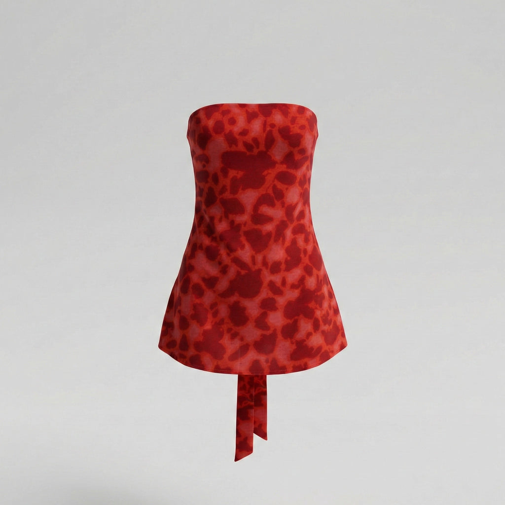 Red strapless dress with a pattern on a gray background