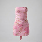 Pink floral strapless dress on a gray background