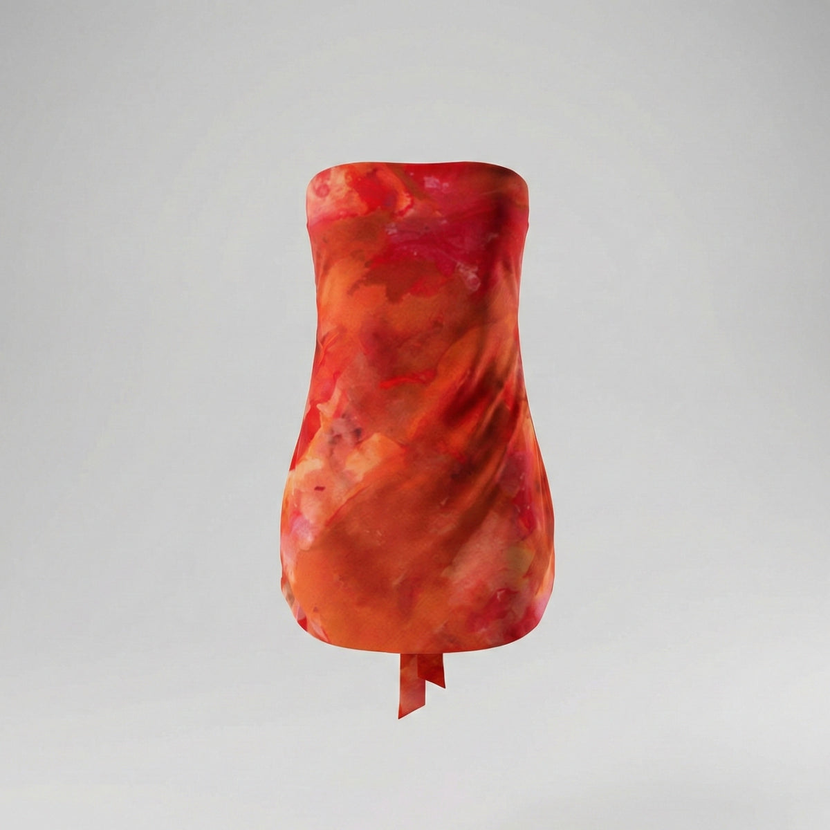 Red and orange strapless top on a gray background