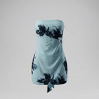 Light blue strapless dress with black floral patterns on a gray background
