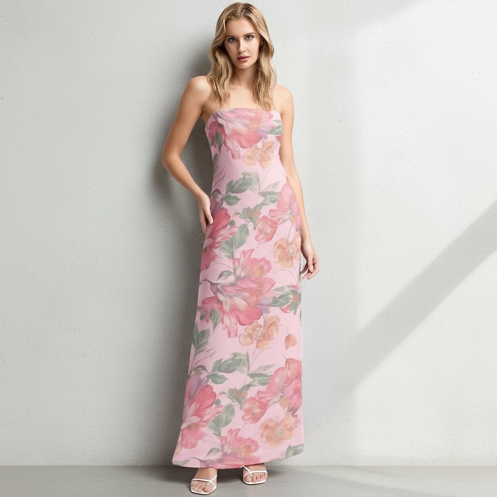 Woman wearing a pink floral dress against a plain background