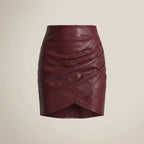 Maroon leather skirt on a beige background