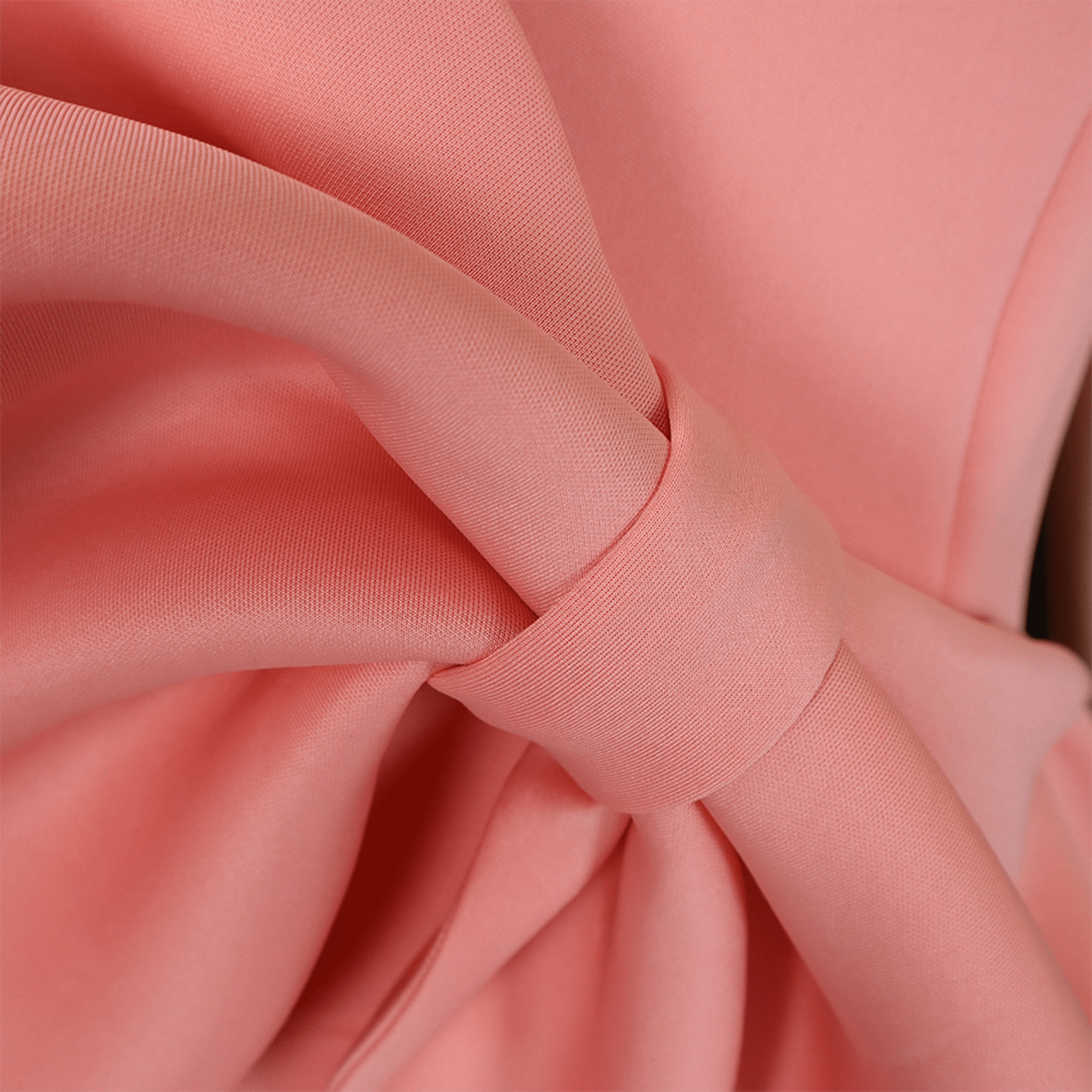 Close-up of pink fabric with a bow