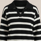 Black and white striped sweater on a beige background