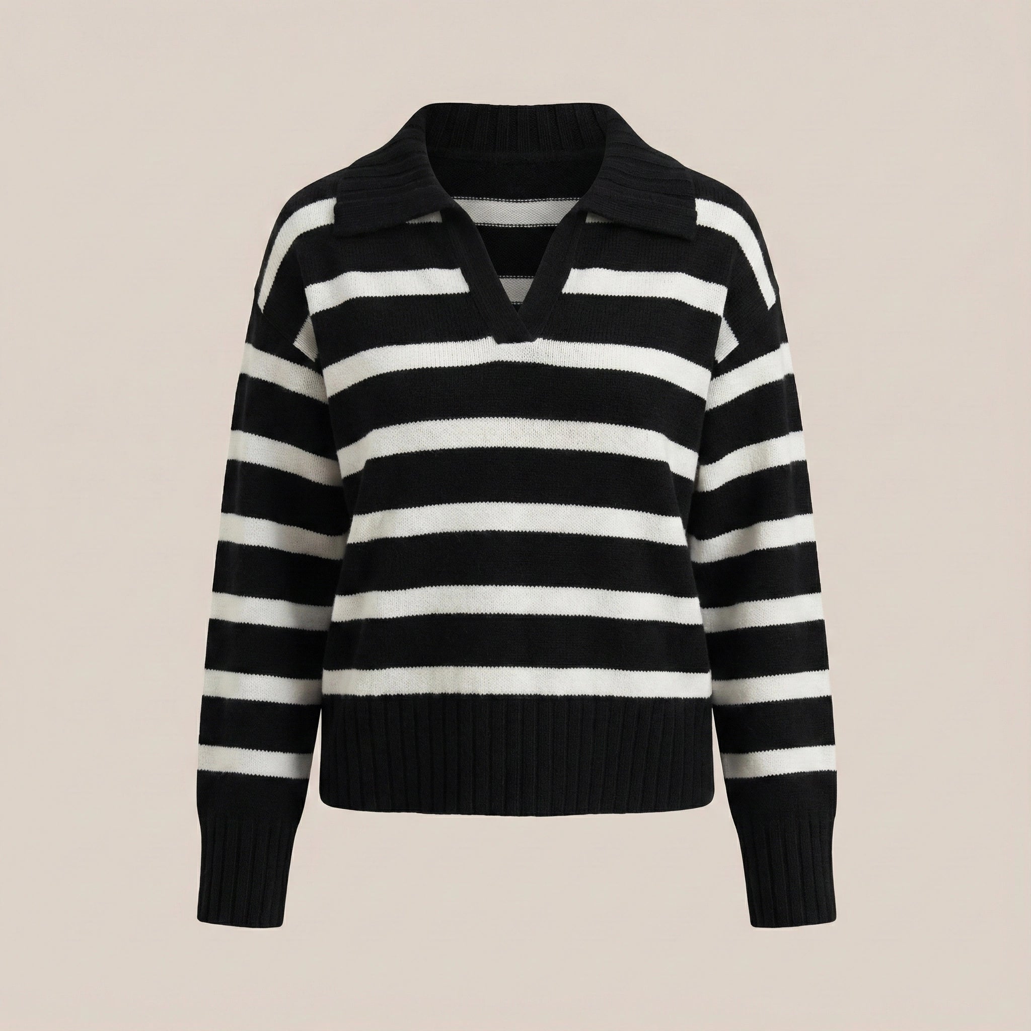 Black and white striped sweater on a beige background