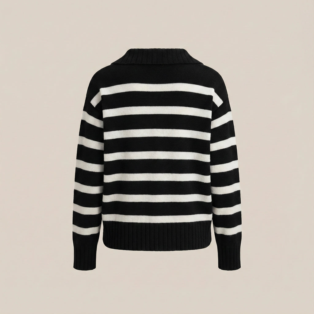 Black and white striped sweater on a beige background