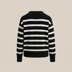 Black and white striped sweater on a beige background