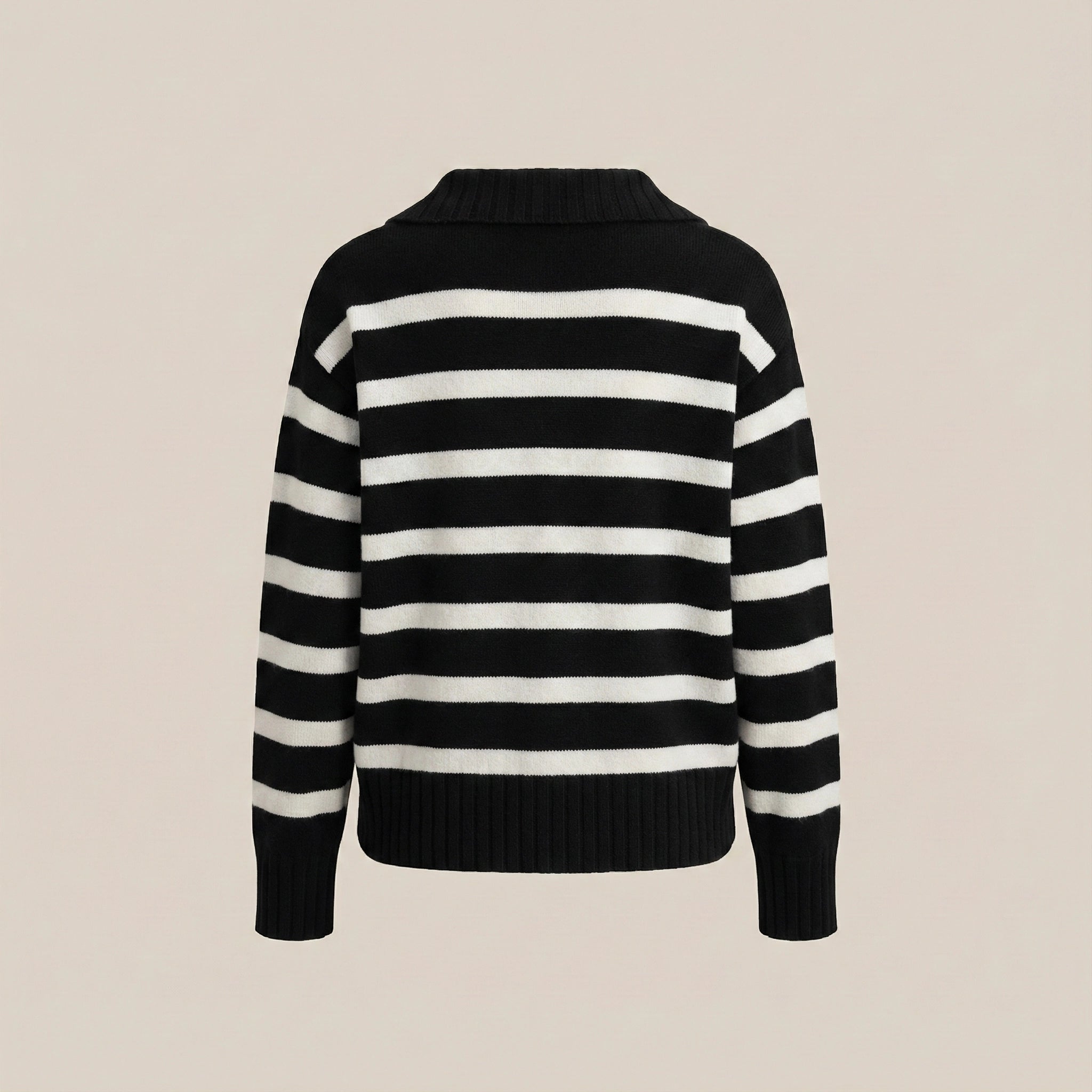 Black and white striped sweater on a beige background