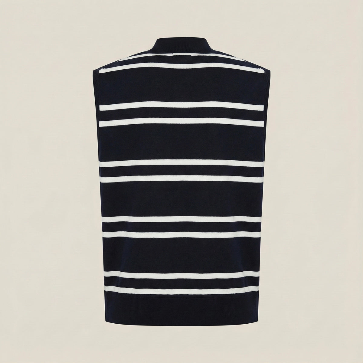 Black and white striped sleeveless sweater on a beige background