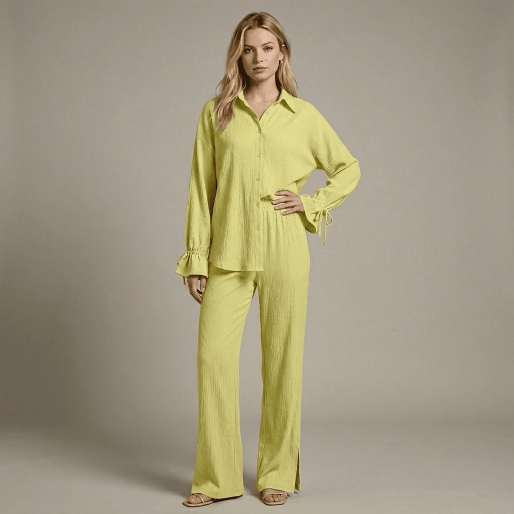 Woman wearing a bright yellow outfit against a neutral background