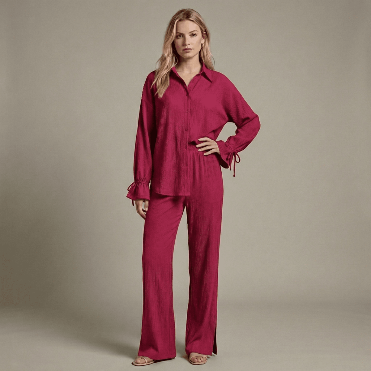 Woman wearing a magenta outfit against a neutral background