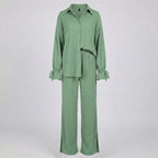 Green outfit with a shirt and pants on a white background