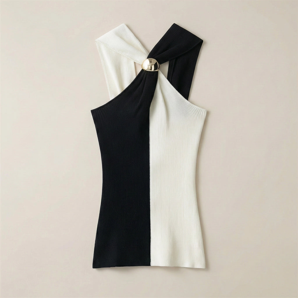 Black and white one-shoulder dress on a beige background