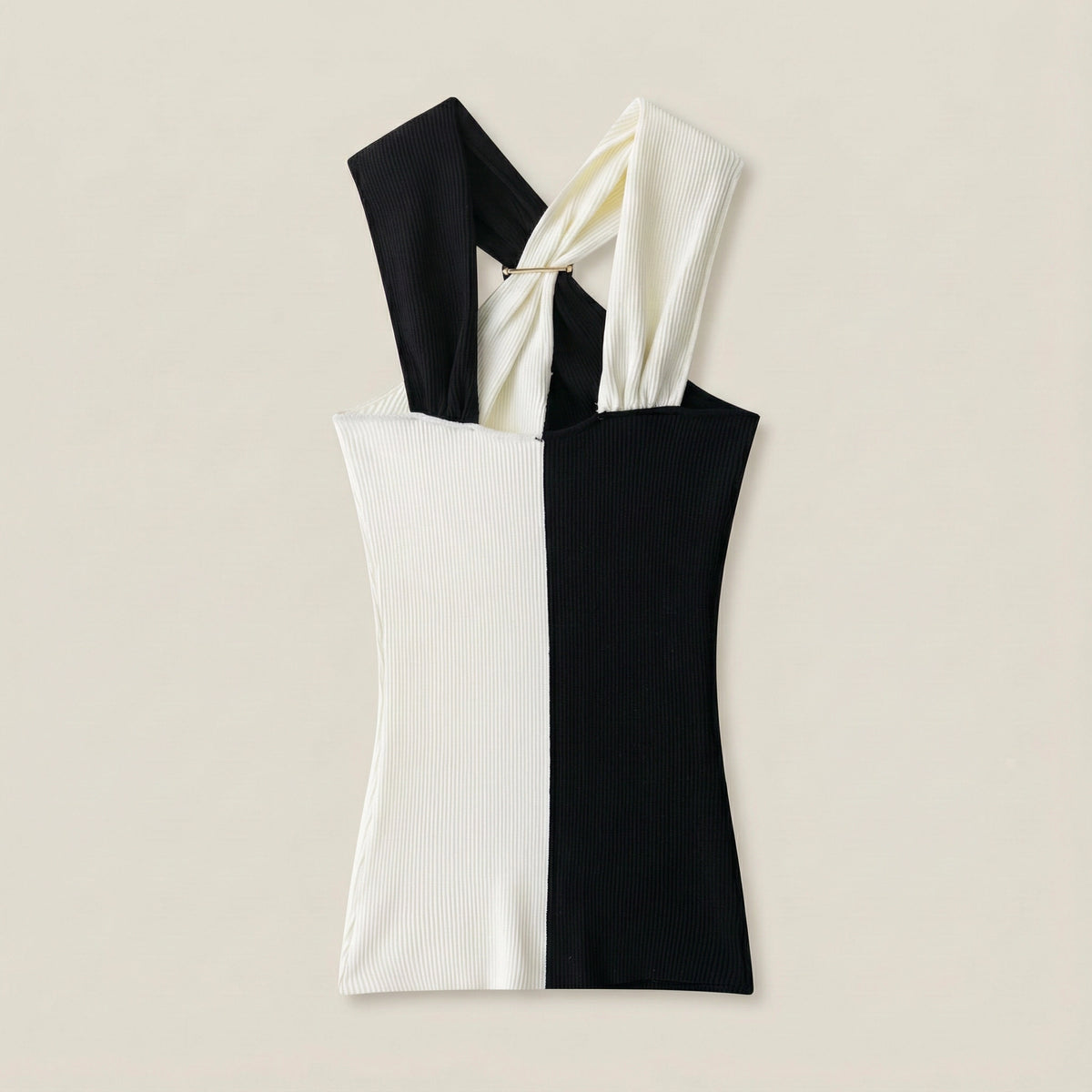 Black and white dress with a knot detail on a beige background