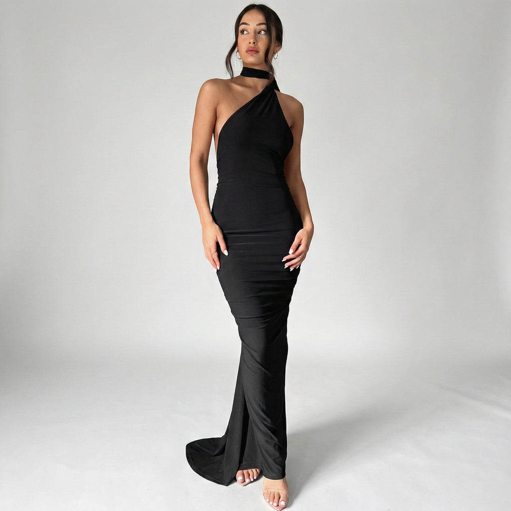 Woman wearing a black one-shoulder dress on a white background