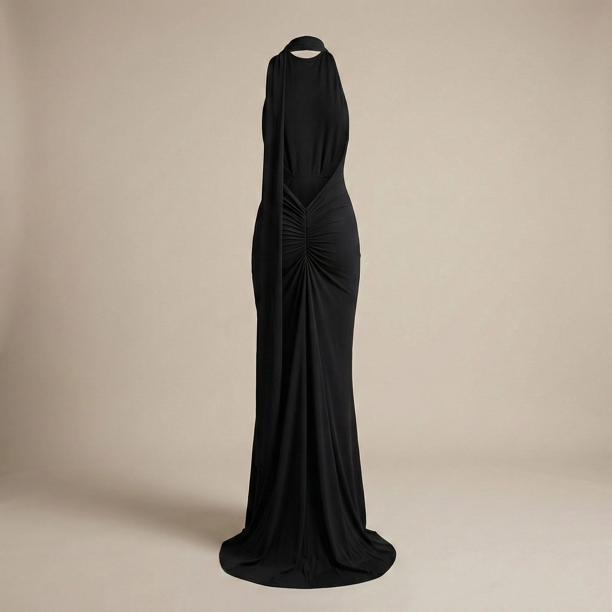 Black evening gown on a beige background