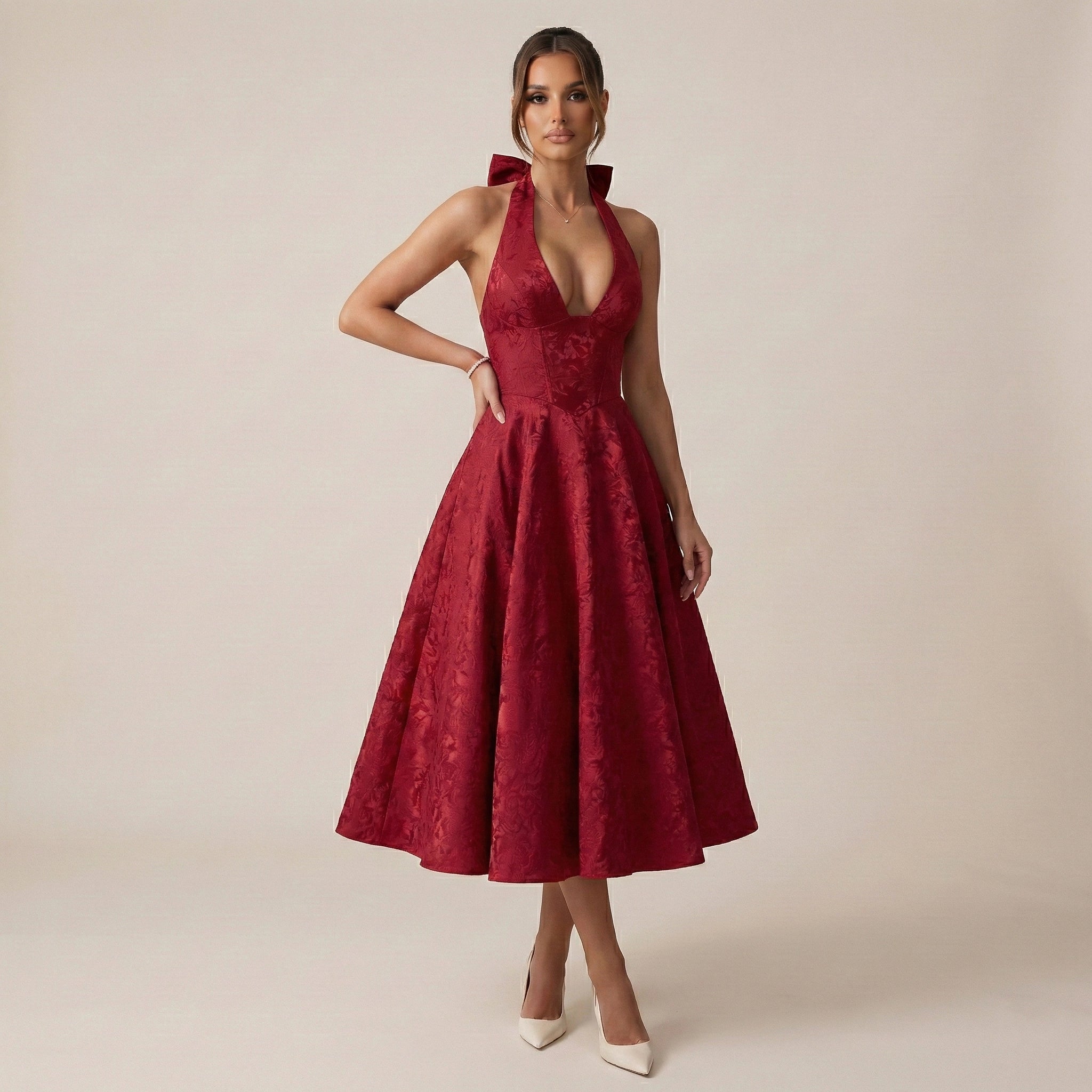 Woman wearing a red dress with a deep neckline on a beige background