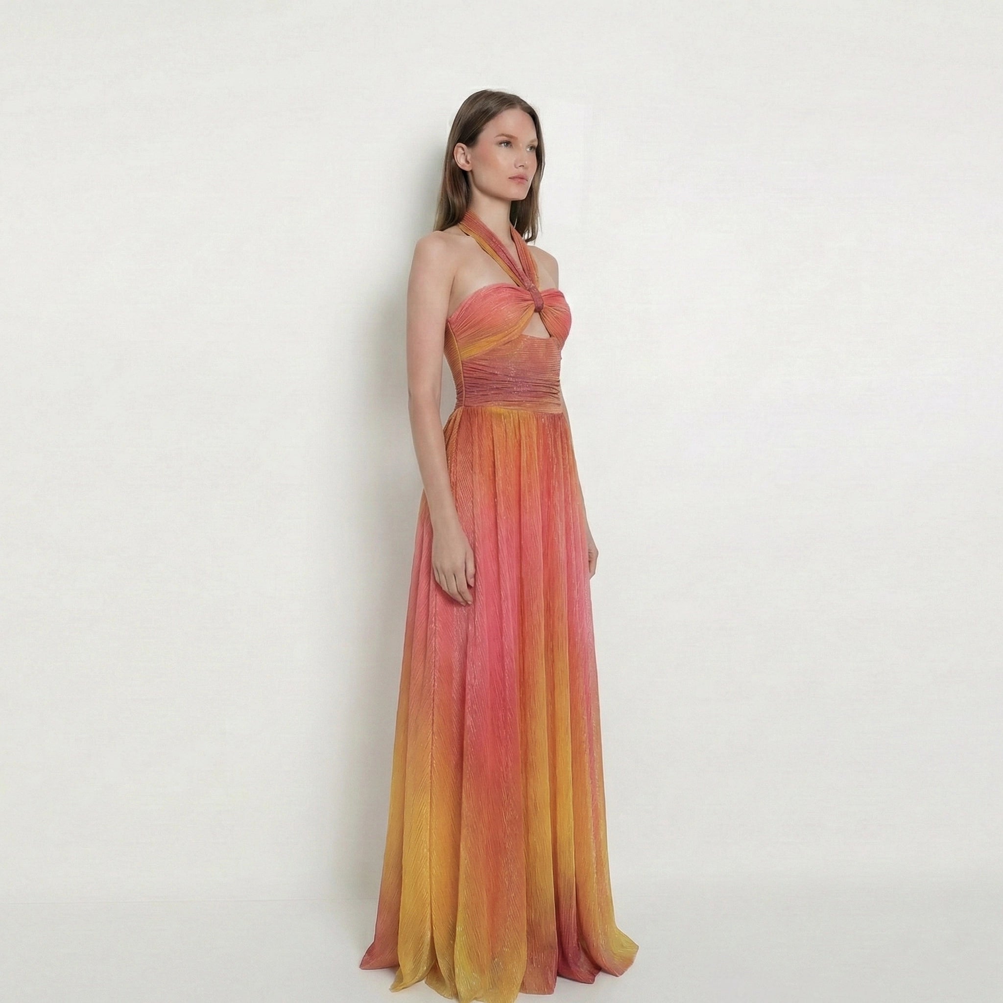 Woman wearing a colorful dress with an ombre effect on a white background