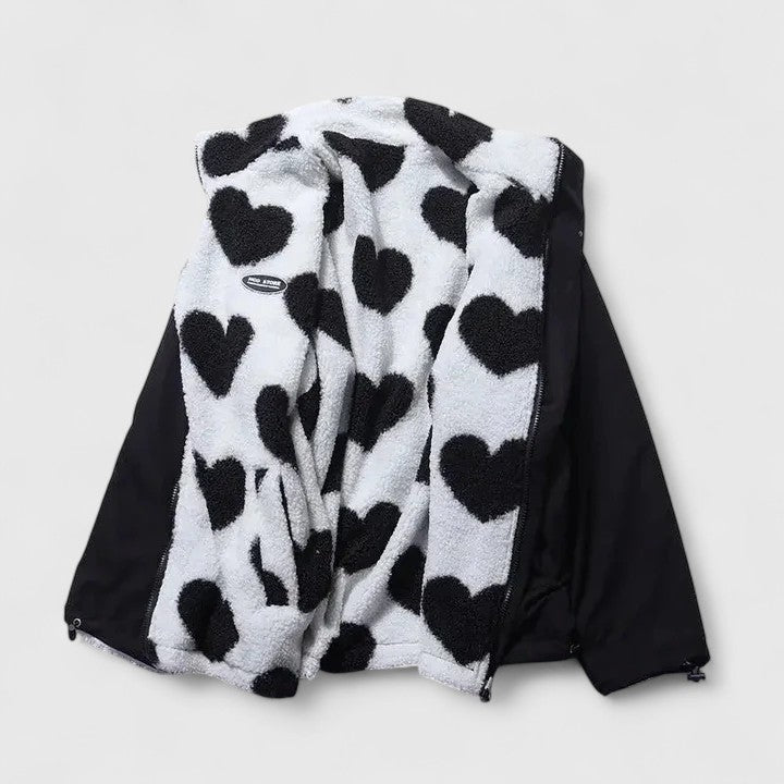 Black and white heart-patterned jacket on a light gray background