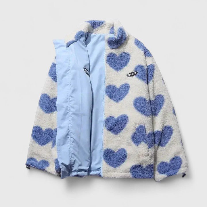 Fleece jacket with blue heart patterns on a light gray background