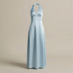 Light blue halter neck dress on a beige background
