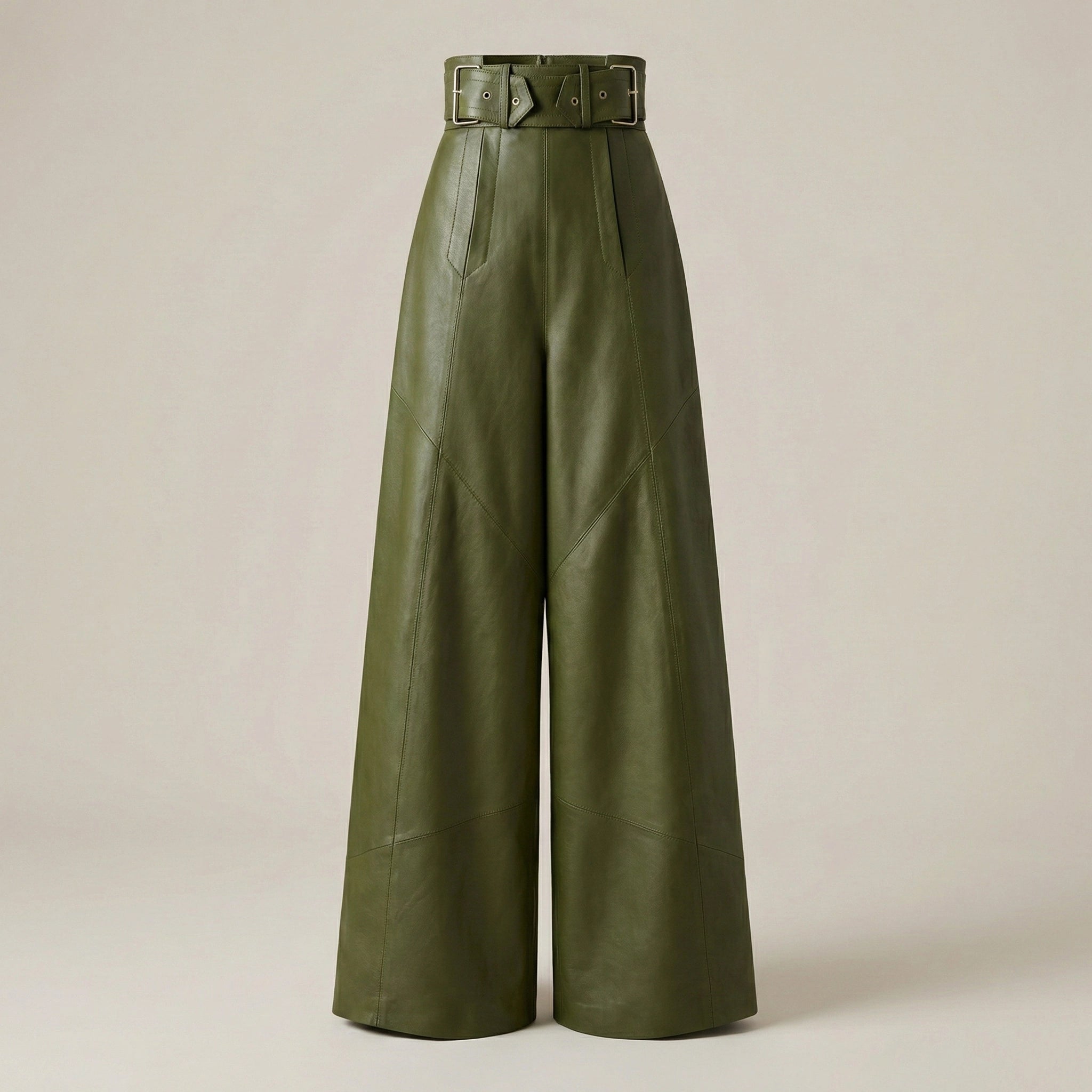Green leather wide-leg pants with a belt on a beige background