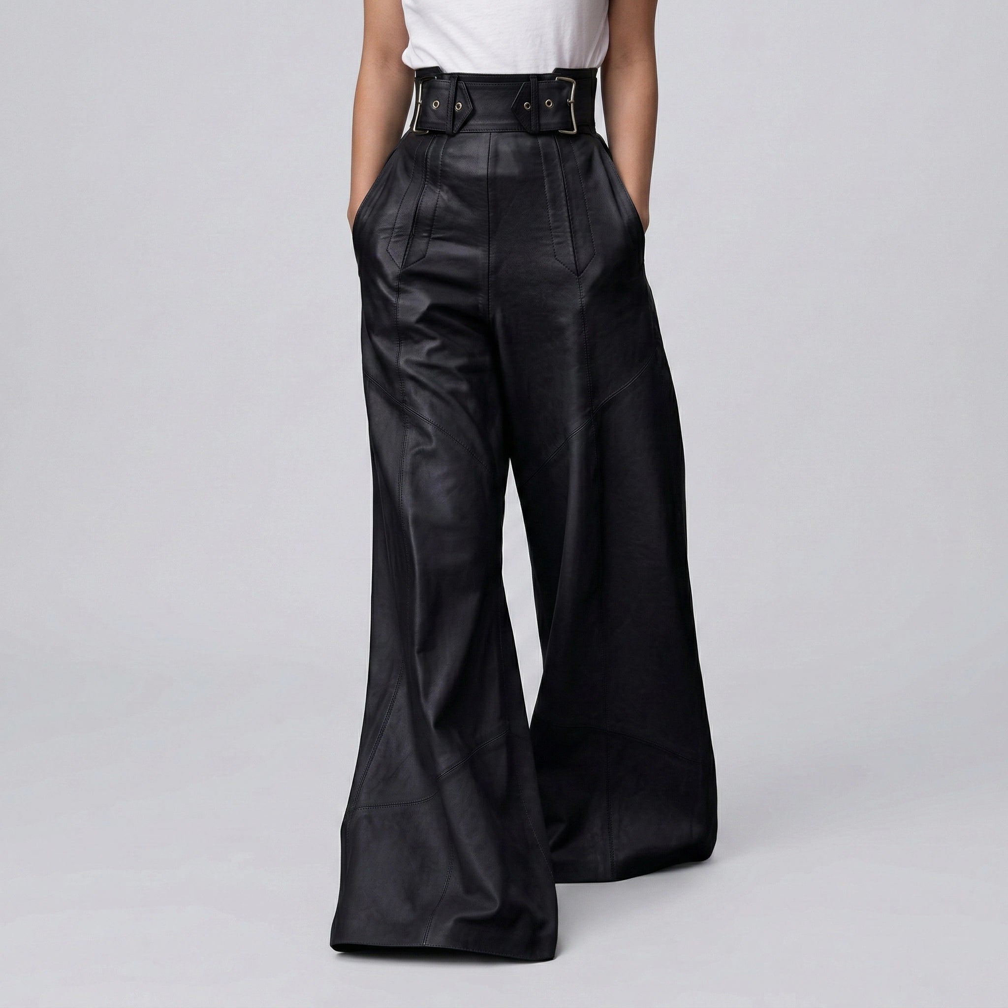 Black leather wide-leg pants worn by a person on a gray background