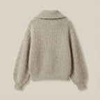 Knitted sweater on a beige background