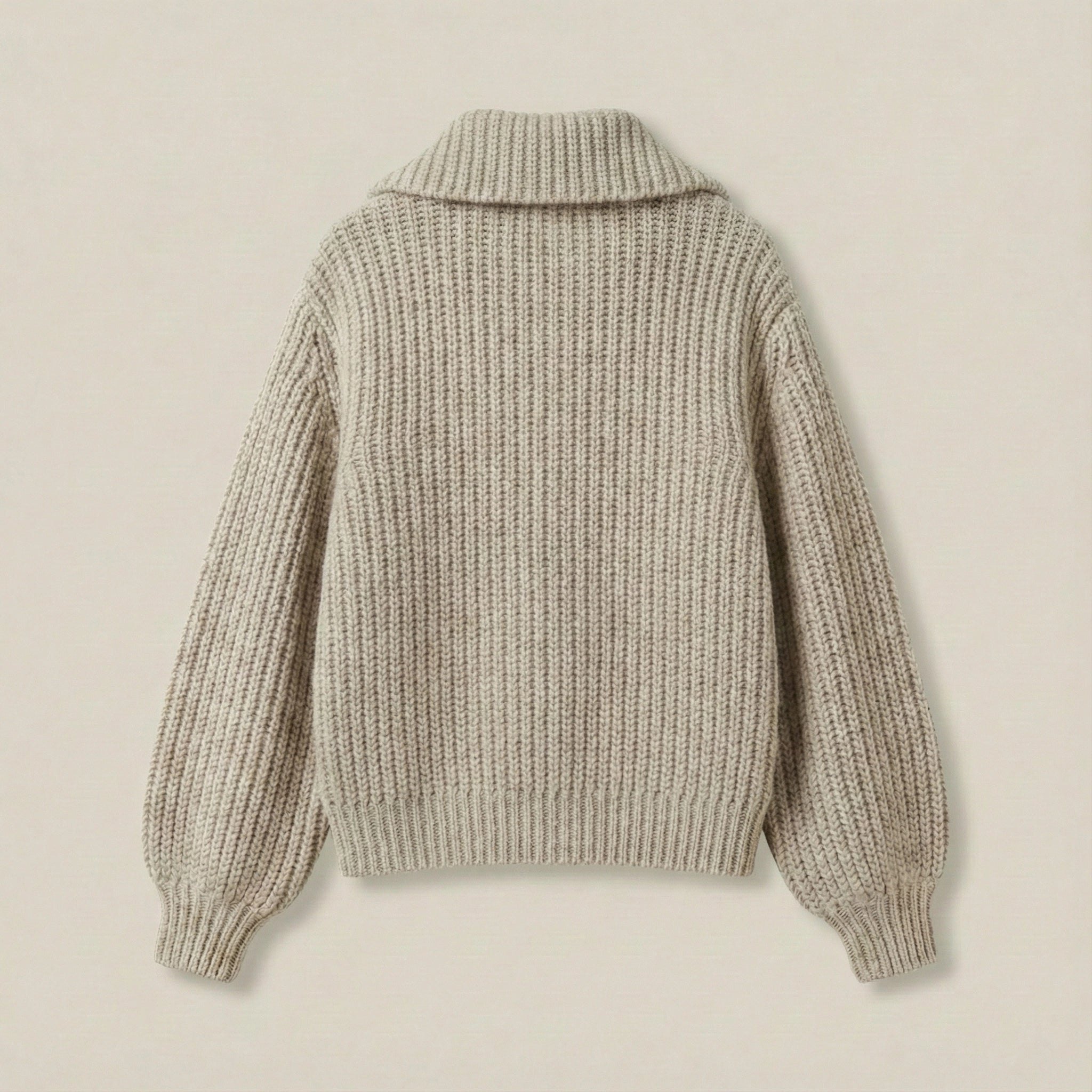 Knitted sweater on a beige background