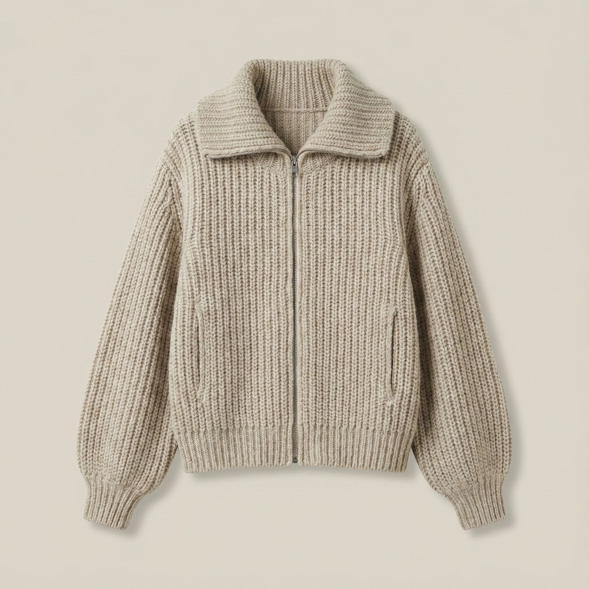 Beige knitted sweater on a beige background